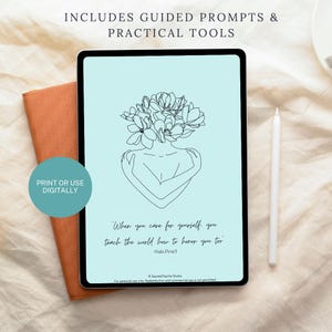 May include: A digital tablet with a light blue screen displays a line drawing of a person embracing themself, with a floral headpiece. The text reads, "When you care for yourself, you teach the world how to honor you too." Includes guided prompts and practical tools.