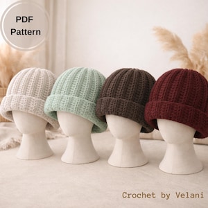May include: Four crocheted beanies in neutral colors are displayed on mannequin heads. The hats are in light beige, mint green, dark brown, and burgundy. The text "PDF Pattern" is in the upper left corner. The text "Crochet by Velani" is in the lower right corner.