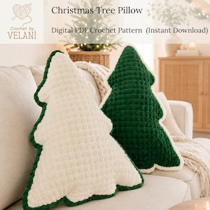 May include: Two Christmas tree-shaped pillows featuring a textured crochet design. One pillow is cream-colored with a dark green border, and the other is dark green with a cream-colored border. Text reads: Christmas Tree Pillow Digital PDF Crochet Pattern.