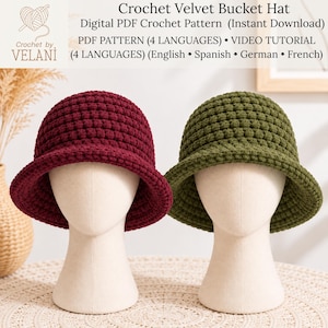 May include: Two crochet velvet bucket hats, one in deep burgundy and one in olive green, displayed on two mannequin heads. The text reads: Crochet Velvet Bucket Hat, Digital PDF Crochet Pattern, PDF PATTERN (4 LANGUAGES), VIDEO TUTORIAL.