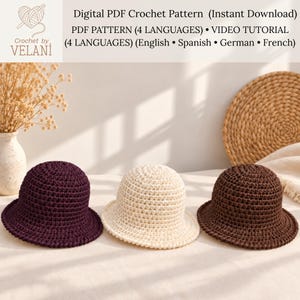 May include: Three crochet bucket hats in dark purple, cream, and brown. The text reads: Digital PDF Crochet Pattern (Instant Download) PDF PATTERN (4 LANGUAGES) • VIDEO TUTORIAL (4 LANGUAGES) (English • Spanish • German • French) Crochet by VELANI.