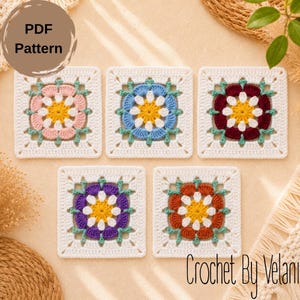 May include: Five square crochet motifs featuring a central yellow flower, white petals, and outer colored petals in pink, blue, dark red, purple, and orange, framed by white borders and green accents. The image includes the text PDF Pattern.