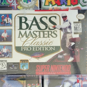 May include: A Super Nintendo video game box for Bass Masters Classic Pro Edition. The box features images of anglers, the game title, and the Super Nintendo logo. The box is sealed in plastic.