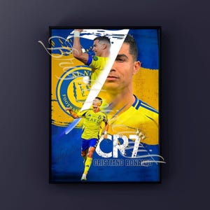 May include: Framed poster featuring Cristiano Ronaldo in a yellow and blue soccer uniform. The poster includes the text "CR7" and "Cristiano Ronaldo" in white. The background is a blend of yellow and blue.