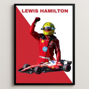 May include: A framed poster featuring Lewis Hamilton wearing a red racing suit and a yellow helmet with a raised fist. A red and white Formula 1 race car with the number 44 is positioned in front. The background is split diagonally between red and white.