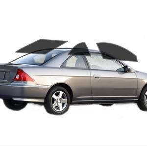 May include: A silver coupe car with tinted windows. The car is shown from a side angle, with the rear and side windows tinted black. The car has a spoiler and alloy wheels. The background is white.