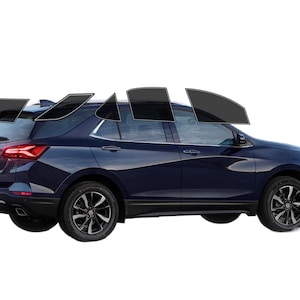 May include: A dark blue SUV with tinted windows. The vehicle has black wheels and a black trim along the bottom. The taillights are red. The windows are tinted black.