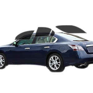 May include: A dark blue sedan with tinted windows. The car has silver rims and a chrome trim. The image shows the car from the side and rear, with the windows partially tinted.