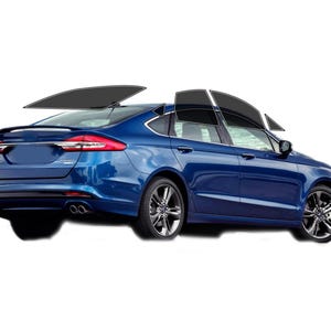 May include: A blue sedan with tinted windows, shown from a rear three-quarter view. The car has black rims and a spoiler. The windows are tinted black, and the car is set against a white background.