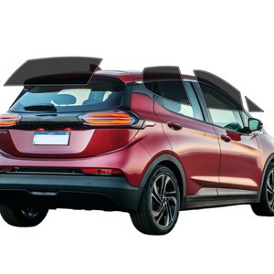 May include: A red hatchback car with tinted windows. The vehicle has black wheels and a black trim. The taillights are illuminated. The car is set against a white background.