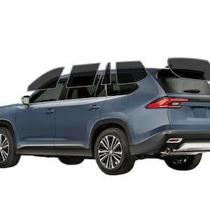 May include: A blue SUV with tinted windows, shown in a side view. The vehicle has black wheels and a silver accent on the rear bumper. The taillights are red, and the car is set against a white background.