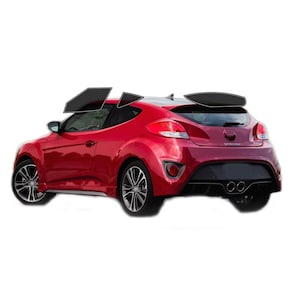 May include: A red sports car with black rims and tinted windows. The vehicle has a rear spoiler and dual exhaust pipes. The car is set against a white background.