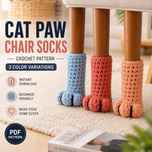 May include: Three crochet cat paw chair socks in light blue, coral, and peach, each featuring black yarn detailing on the toes. The text reads: CAT PAW CHAIR SOCKS, CROCHET PATTERN, 3 COLOR VARIATIONS, INSTANT DOWNLOAD, BEGINNER FRIENDLY, MAKE YOUR HOME CUTER, PDF PATTERN.