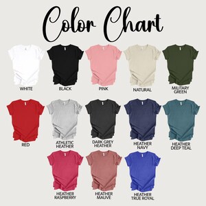 May include: A color chart displaying various t-shirt colors. The chart includes colors such as white, black, pink, natural, military green, red, athletic heather, dark grey heather, heather navy, heather deep teal, heather raspberry, heather mauve, and heather true royal.