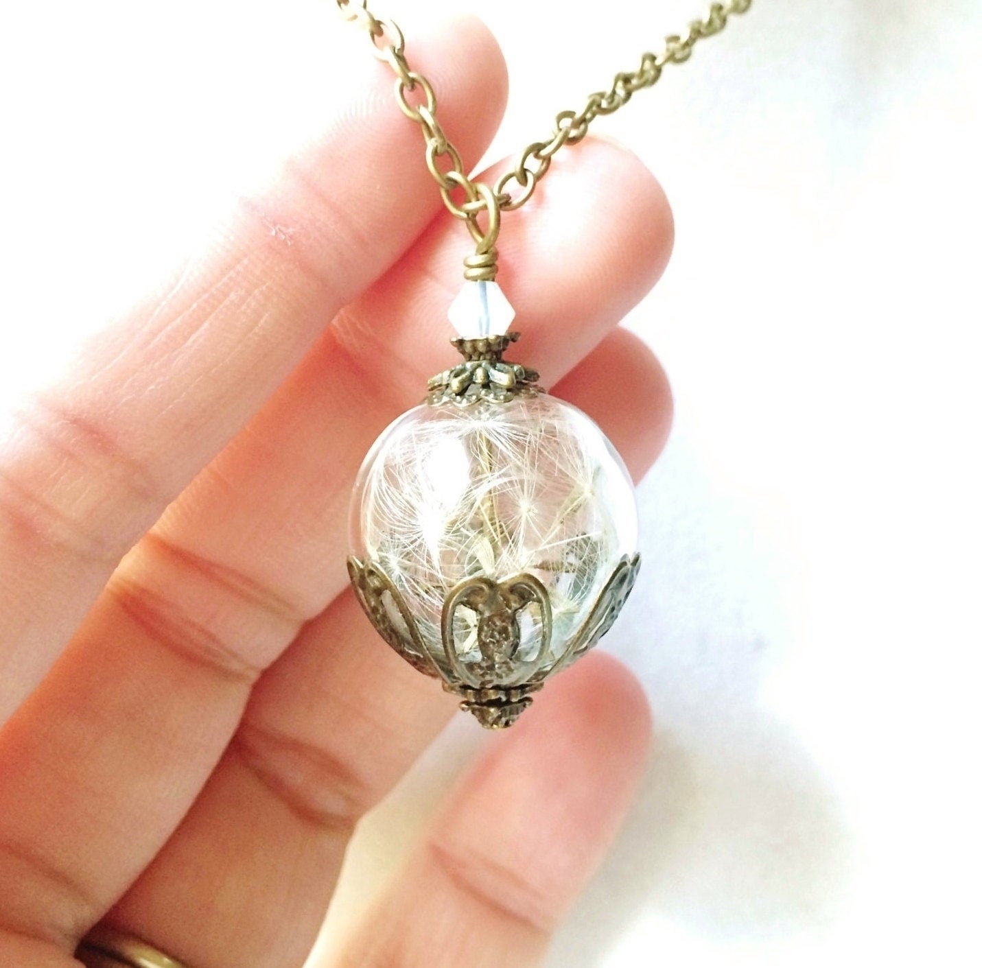 Dandelion Seed Filled Glass Orb Necklace with a Tiny Opalescent Cryst…