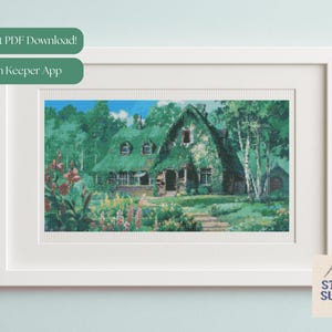 May include: A framed cross-stitch pattern depicting a cottage with a green, thatched roof and a garden full of flowers. The image is in a white frame, with text that reads "Instant PDF Download!" and "Pattern Keeper App."