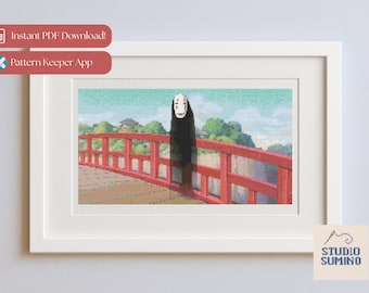 May include: Framed cross-stitch art featuring a scene from Spirited Away. The artwork depicts a red bridge, a figure in black, and a serene landscape with a light blue sky and green trees. The frame is white.