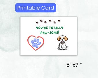 May include: Printable card with a white background. The card features a red heart with a blue paw print, a cartoon puppy, and the text "YOU'RE TOTALLY PAW-SOME!". The card measures 5" x 7".