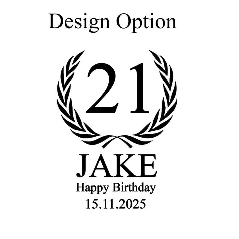 May include: Black and white design with the text "Design Option". The number "21" is inside a laurel wreath. Below the wreath is the name "JAKE", and the text "Happy Birthday 15.11.2025".