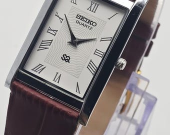 Vintage Seiko Slim Tank Quartz Men's Wrist Watch ,New Battery, White dial watch