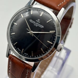 Reloj Jaeger-LeCoultre Club Vintage para hombre, de fabricación suiza, con esfera negra y un diseño de lujo.