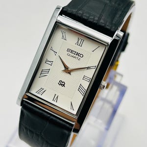Vintage Seiko Slim Tank Quartz Uhr - Weißes Zifferblatt, Silbernes Gehäuse, Unisex Kleideruhr, minimalistische japanische Uhr, seltene 90er Jahre Retro