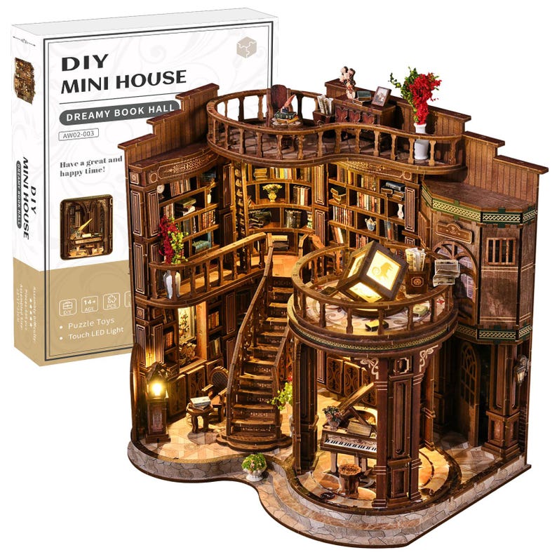May include: A DIY Mini House kit, featuring a Dreamy Book Hall design. The wooden model showcases a detailed library with multiple levels, bookshelves, a grand piano, and a staircase. The kit includes puzzle toys and touch LED lights. The box reads "Have a great and happy time!"