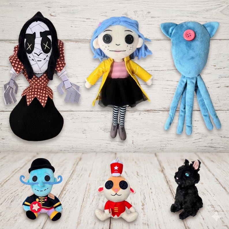 May include: A collection of six plush dolls including a figure with a black hood and checkered pattern, a doll with blue hair and a yellow coat, a blue octopus-like creature with a pink button, a blue character with a mustache, a small animal in a red uniform, and a black cat.