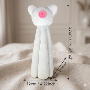 May include: A light blue plush cat toy with a pink button nose. The toy measures 14.57 inches in height, 4.72 inches in width, and 3.54 inches in depth. The cat has pointed ears and a long, segmented body structure made of soft fabric.