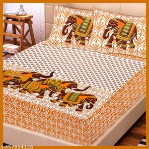 May include: A bed set featuring a white and orange patterned design with elephant motifs. The set includes a fitted sheet, a flat sheet, and two pillowcases. The elephants are brown with orange and green accents.