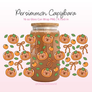 May include: A 16 oz glass can with a bamboo lid featuring a repeating pattern of brown capybaras inside orange persimmons, small orange fruits, green leaves, and orange bows. Text reads Persimmon Capybara 16 oz Glass Can Wrap PNG 9.75x5 in.