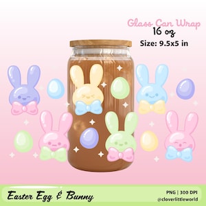 May include: A glass can wrap with a wooden lid, decorated with pastel-colored Easter bunnies and eggs. The wrap is designed for a 16 oz can and measures 9.5x5 inches. The words "Easter Egg & Bunny" are at the bottom.