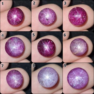 May include: A collection of nine round, cabochon-cut star rubies in various shades of pink and red. Each gemstone displays a distinct six-rayed asterism effect across its polished, domed surface, numbered one through nine in a grid layout.