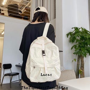 Embroidered Canvas Backpack: Solid Color Commuter Bag