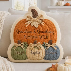 May include: A pumpkin-shaped decorative pillow featuring a large orange pumpkin with the text Grandma & Grandpa's PUMPKIN PATCH. Below are three smaller pumpkins in green, beige, and blue, each personalized with the names Joseph, Sophia, and Harper.