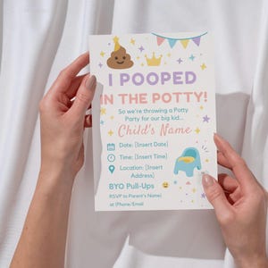 May include: A white invitation card with the text "I POOPED IN THE POTTY!" and details for a potty party. The card features a smiling poop emoji, a crown, and a blue potty chair illustration. The card is held by a person.