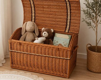 May include: A rectangular brown woven wicker storage chest with an open hinged lid. Inside the chest are a beige plush rabbit, a brown plush teddy bear, a small white plush toy, and a book with a light green cover and illustrated pages.