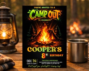May include: A black invitation card with the text "Camp Out" and "Cooper's 8th Birthday". The design features a campfire, tents, and trees. A lantern, a mug, and a blanket are on a wooden table in the background.