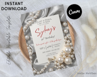 Puede incluir: Una tarjeta de invitación para un 30 cumpleaños con el nombre "Sydney's" en escritura roja. La tarjeta está adornada con perlas y descansa sobre un plato de madera. El texto dice "Elegant in Pearls, Chic in Satin".