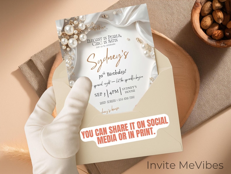 May include: An invitation card for a 30th birthday, featuring elegant pearl and satin details. The card is in a cream envelope, with the text "YOU CAN SHARE IT ON SOCIAL MEDIA OR IN PRINT."