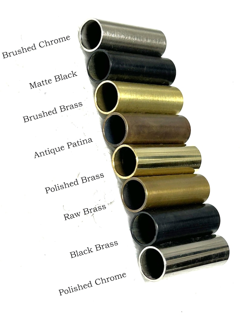 May include: An assortment of cylindrical metal tubes in various finishes, including brushed chrome, matte black, brushed brass, antique patina, polished brass, raw brass, black brass, and polished chrome. The names of the finishes are printed in black text.