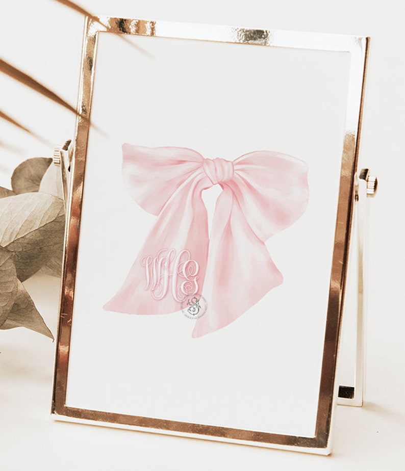 May include: A pink watercolor bow with a monogram of the letters "WFC" in the center.