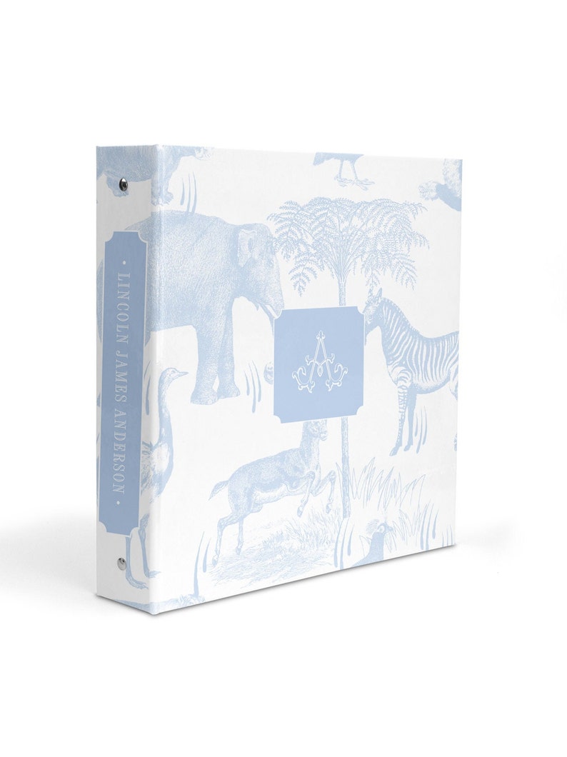 May include: A light blue binder with a white background and a pattern of blue animals, including an elephant, zebra, and deer. The binder has a spine with the text "LINCOLN JAMES ANDERSON." and a blue monogrammed initial "A" on the front.