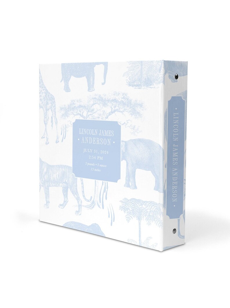 May include: A light blue baby photo album with a white background and a blue and white pattern of elephants, giraffes, and palm trees. The album has a spine with the text "LINCOLN JAMES ANDERSON." and a label on the front that reads "LINCOLN JAMES &bull; ANDERSON &bull; JULY 31, 2024 &bull; 2:54 PM &bull; 5 pounds - 3 ounces &bull; 15 inches."