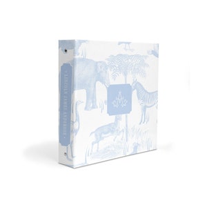 May include: A light blue binder with a white background and a pattern of blue animals, including an elephant, zebra, deer, and ostrich. The binder has a silver ring mechanism and a label on the spine that reads "LINCOLN JAMES ANDERSON".