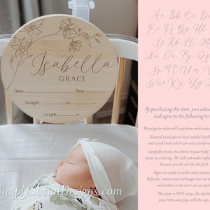 May include: A round wooden sign with a floral design and the name "Isabella Grace" engraved on it. The sign has spaces to record the date, time, weight in ounces, and length in inches.  The sign is displayed on a white crib.