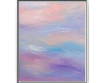 May include: A framed rectangular wall art piece featuring an abstract painting with blended gradients of soft pink, lavender, light blue, and white hues. The composition displays smooth, horizontal colour transitions within a thin, light-coloured frame.