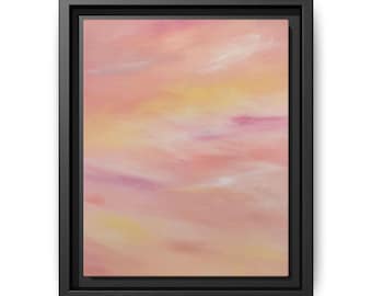 May include: A rectangular canvas painting featuring soft, blended strokes of pastel pink, peach, and pale yellow hues, resembling a sunset sky. The artwork is encased in a simple, solid black frame with a deep, recessed border profile.