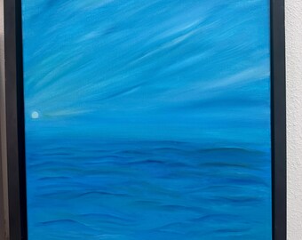 May include: A framed oil painting on canvas depicting a vast blue ocean under a bright blue sky with wispy clouds. A small, pale circular moon is visible on the left side of the horizon. The artwork is enclosed in a simple, solid black rectangular frame.