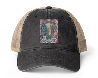 May include: A black baseball cap with a tan mesh back and a rectangular patch on the front. The patch features an abstract painting with blended shades of pink, blue, green, and white, centred with a vertical white brushstroke design.